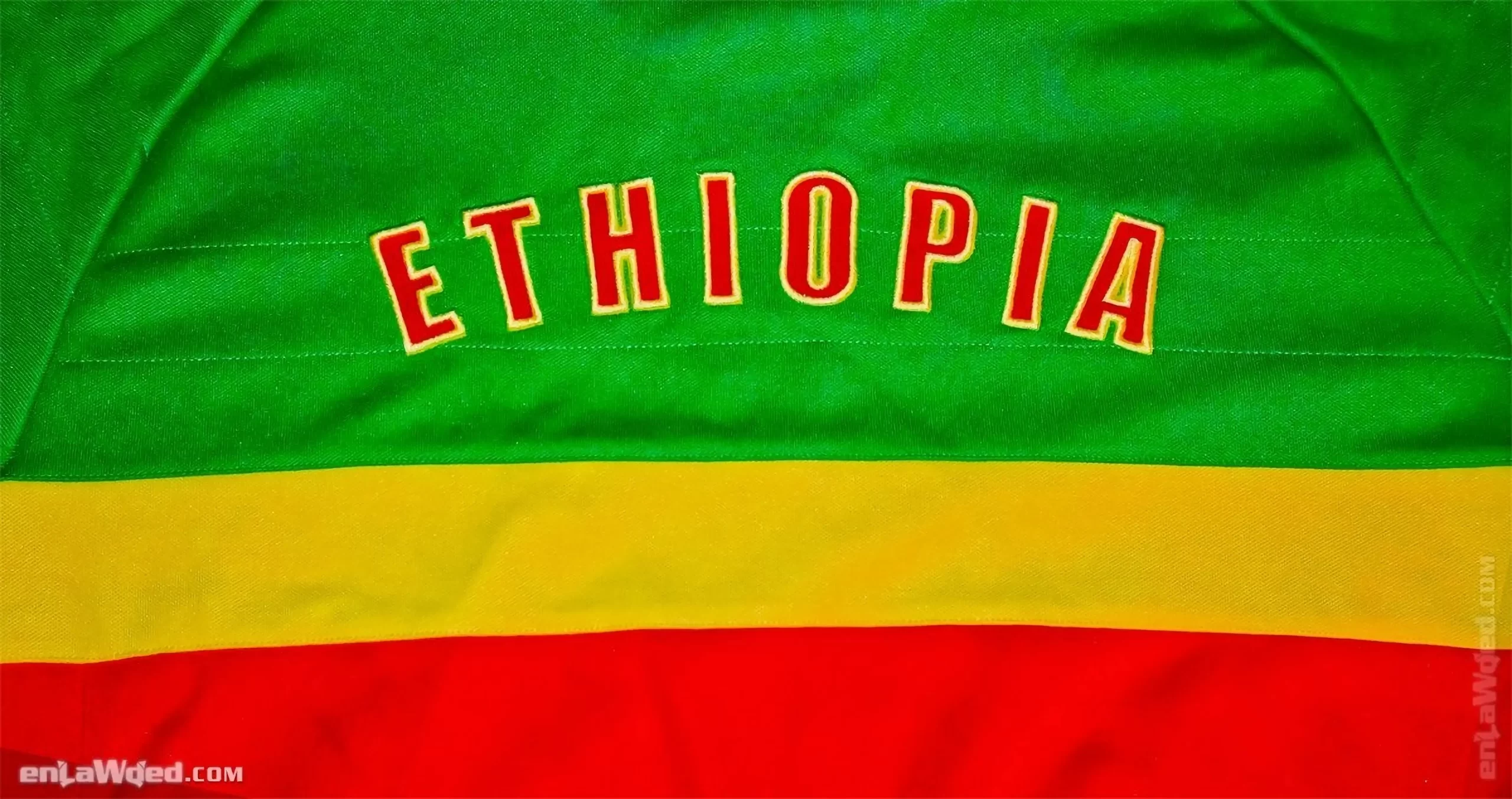 Back face view of the Ethiopian jacket with ETHIOPIA written in big red letters with yellow borders over the green part
