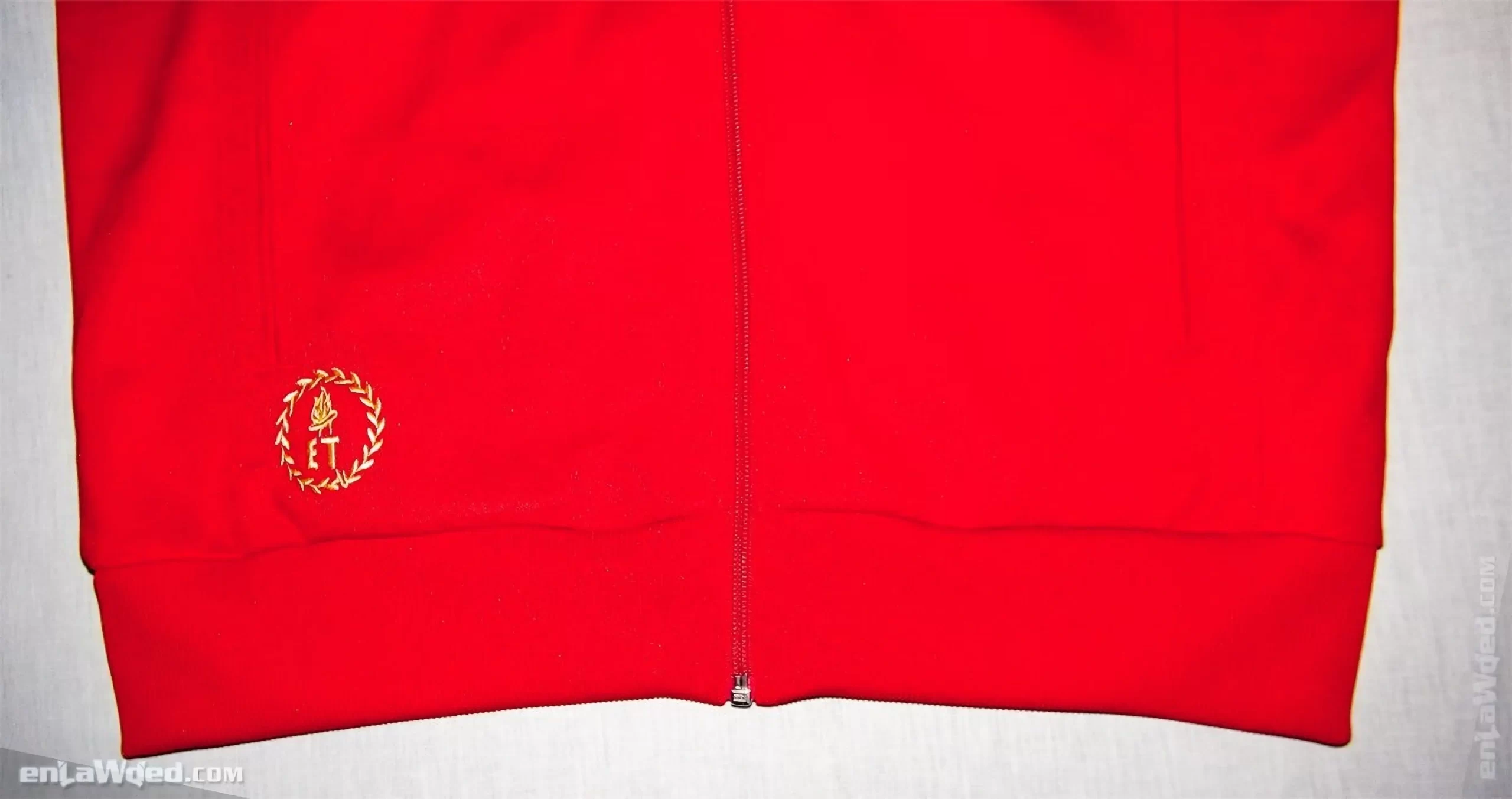 Front view of the bottom of the Ethiopian jacket, with the Torch flame icon in gold